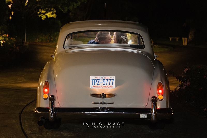 couple leaving their wedding reception in a volkswagon bug