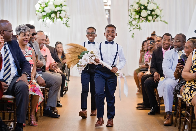 Ring Bearers Carrying Broom at the Cotton Room