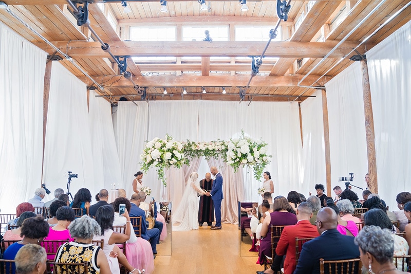 Bride and Groom Exchange Vows at the Cotton Room