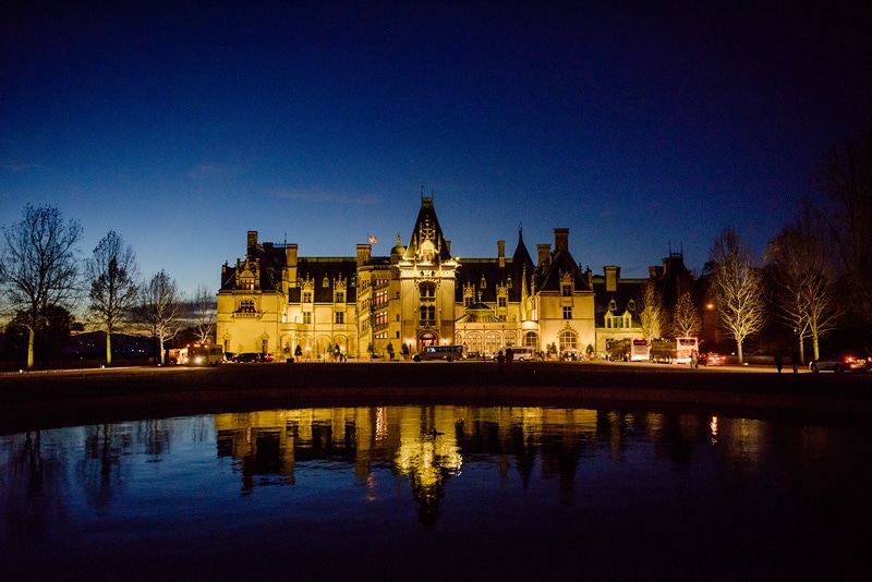 Capture stunning engagement photos at the enchanting Biltmore castle under the mesmerizing night sky.