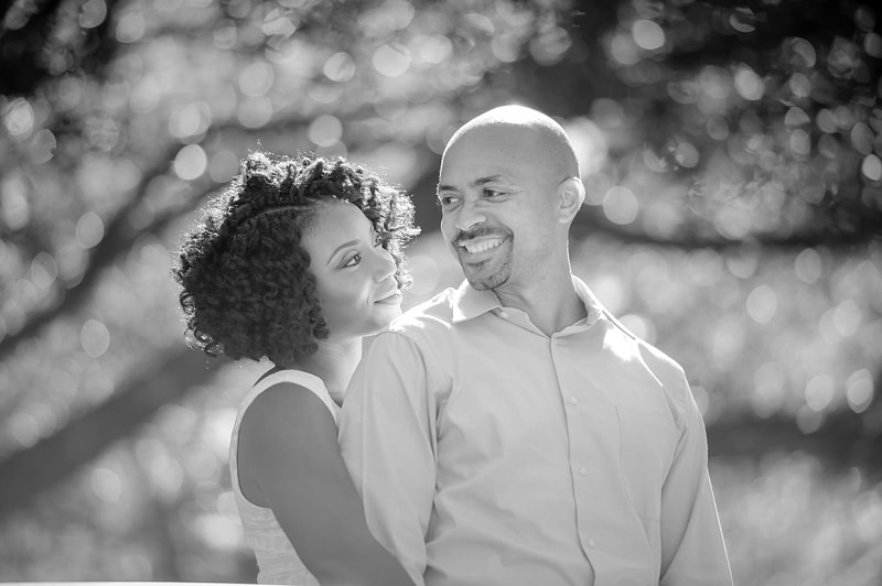 An enchanting engagement photograph capturing the love between a couple in stunning black and white.