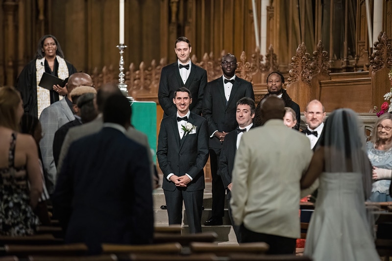 Groom's first look at bride walking down the aisle during Duke Chapel wedding