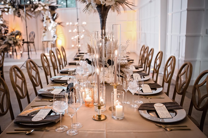 An elegantly decorated table set up for a dinner party at The Distillery wedding