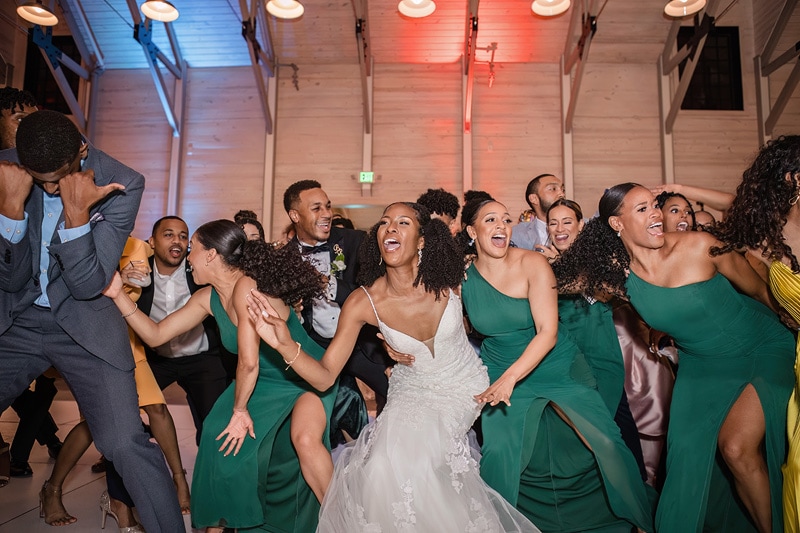 A group of bridesmaids dancing at a Board and Batten Events Wedding reception.