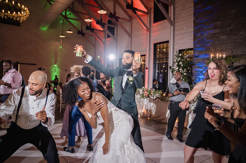 At the Board & Batten Events Wedding, the bride and groom are dancing on the dance floor at their wedding reception.