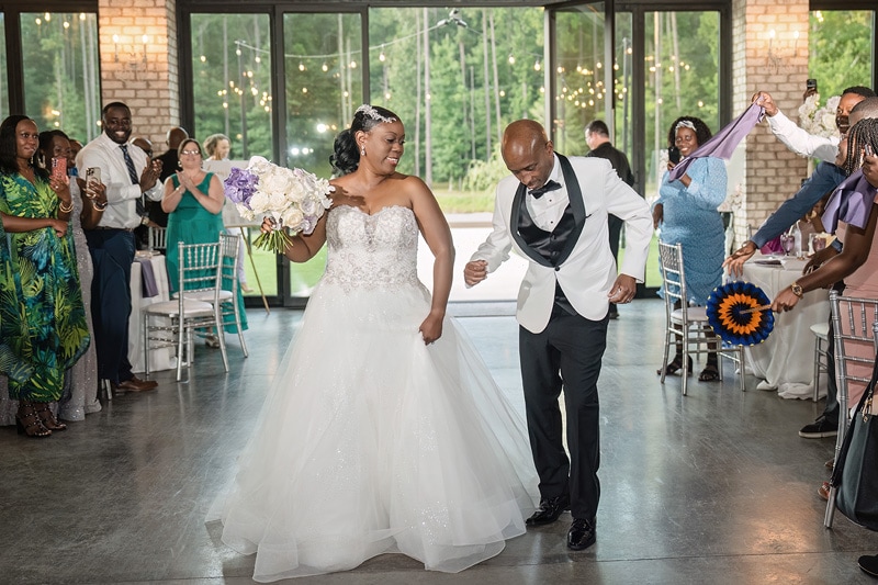 A Pinehill Pavilion wedding showcases a beautiful bride and groom walking down the aisle, surrounded by joy and love.