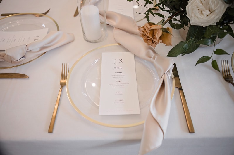 A table setting with a napkin and silverware at The Bradford wedding venue.
