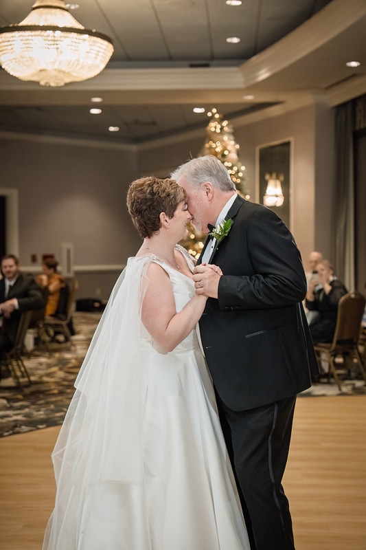 Brad and Shana, a bride and groom, sharing their first dance at their Grandover Resort & Spa wedding reception.