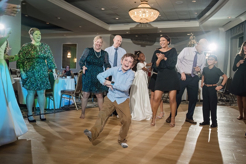 A group of people dancing at a Grandover Resort & Spa Wedding Reception.