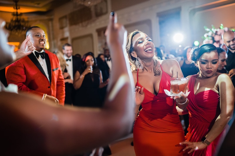 Guests enjoying a lively moment at the grand marquise ballroom during a wedding.